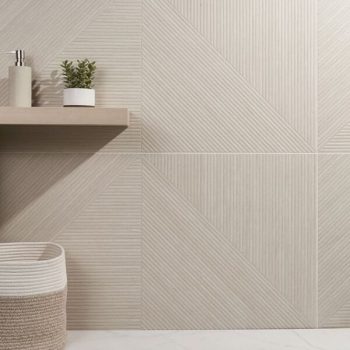 Modern bathroom wall tiled with light beige geometric ceramic tile design and wooden shelf with plant and soap dispenser